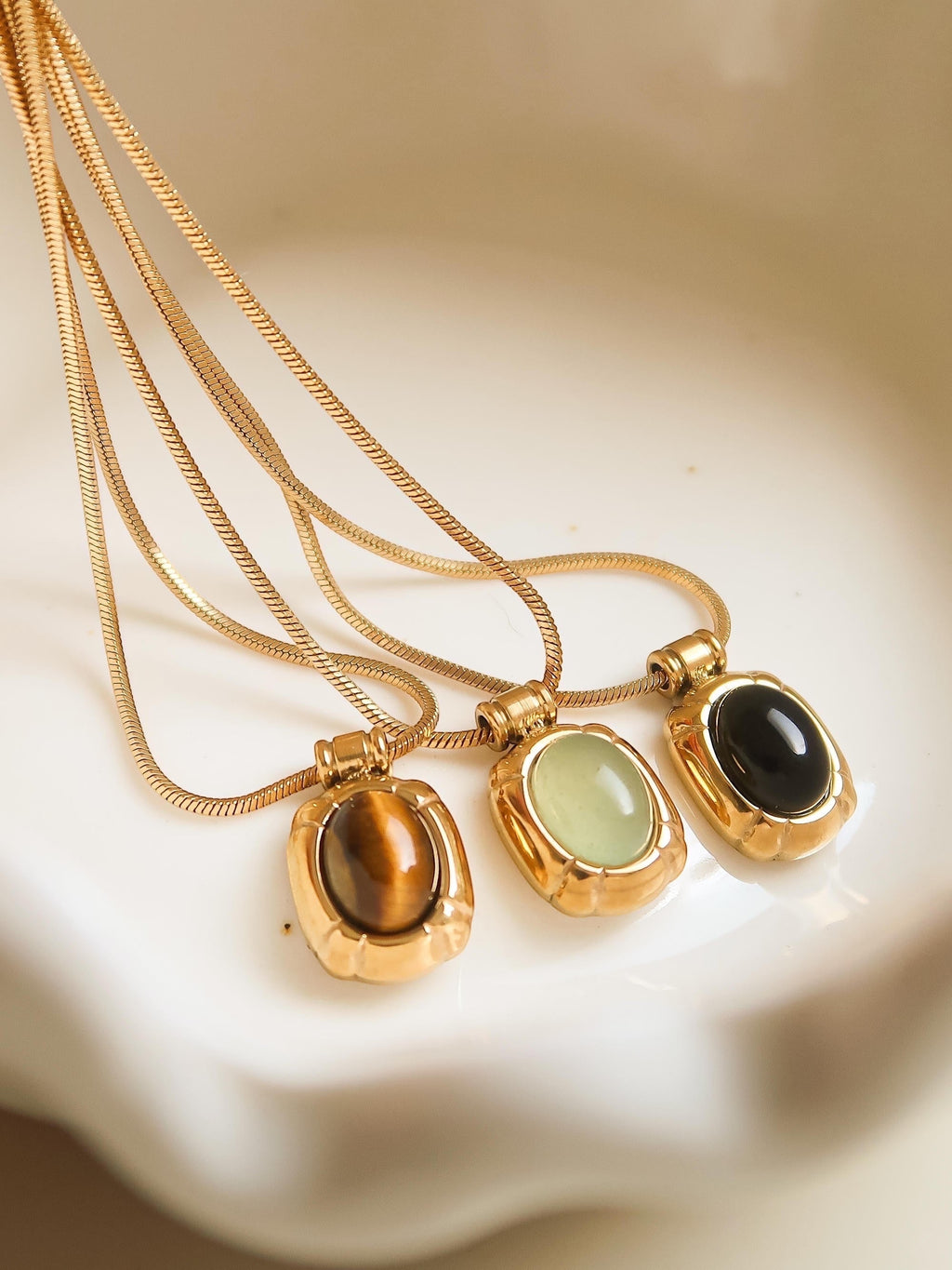 The minimalist design of the pendants, combined with the natural beauty of the stones, makes this set perfect for layering or wearing individually. Whether you're dressing up for a special occasion or adding a touch of subtle elegance to your daily look, these gemstone pendants are sure to become cherished additions to your jewelry collection.