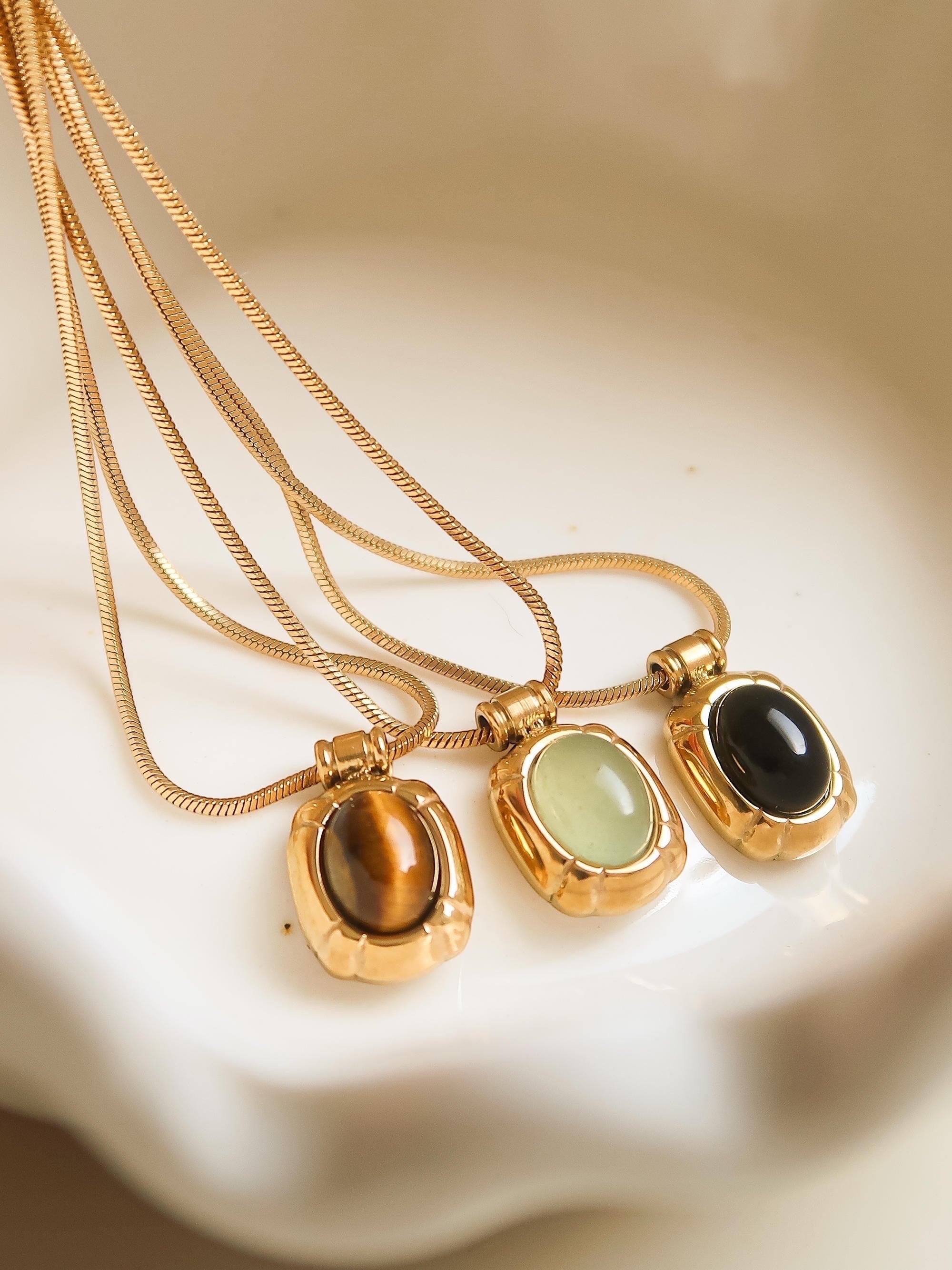 The minimalist design of the pendants, combined with the natural beauty of the stones, makes this set perfect for layering or wearing individually. Whether you're dressing up for a special occasion or adding a touch of subtle elegance to your daily look, these gemstone pendants are sure to become cherished additions to your jewelry collection.