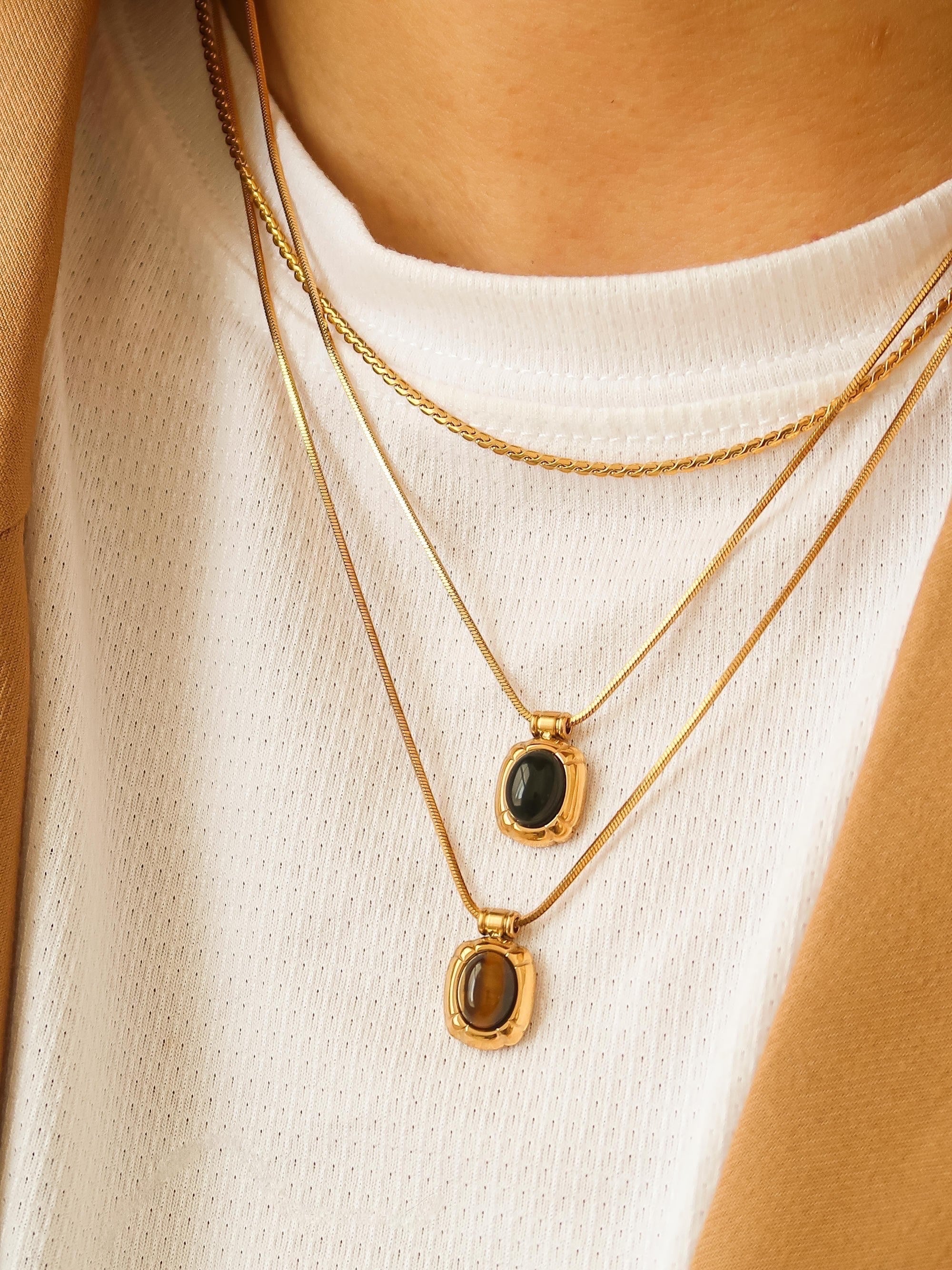 The minimalist design of the pendants, combined with the natural beauty of the stones, makes this set perfect for layering or wearing individually. Whether you're dressing up for a special occasion or adding a touch of subtle elegance to your daily look, these gemstone pendants are sure to become cherished additions to your jewelry collection.