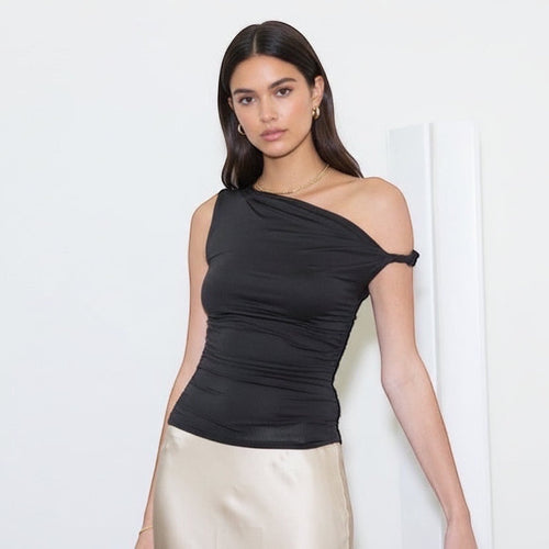 Elevate your wardrobe with this versatile asymmetrical knit top featuring an off-the-shoulder neckline and sleeveless design. The twist shoulder detail and ruched side accents create flattering dimension, while the soft 95% polyester and 5% spandex blend offers comfortable stretch and durability. Perfect for layering or wearing solo, this solid knit top transitions seamlessly from casual to dressed-up occasions.