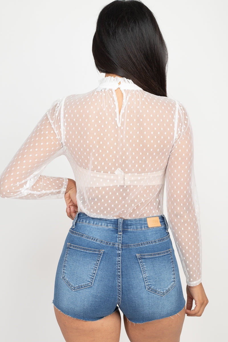 Playful polka dots meet modern mesh in this flirty mock neck top that's ready to turn heads. Long sleeves keep things chic while the back keyhole adds just the right touch of intrigue. Whether you're dressing up for a night out or keeping it casual, this woven wonder brings fun and sophistication to every outfit.