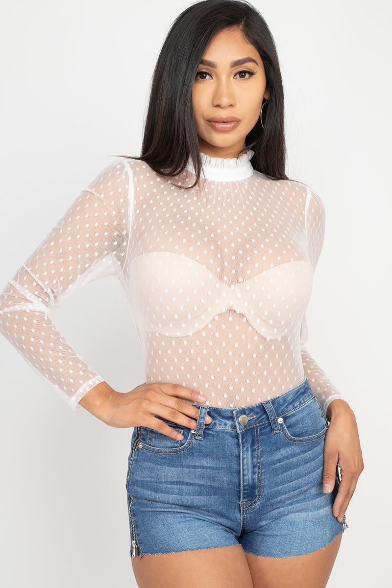 Playful polka dots meet modern mesh in this flirty mock neck top that's ready to turn heads. Long sleeves keep things chic while the back keyhole adds just the right touch of intrigue. Whether you're dressing up for a night out or keeping it casual, this woven wonder brings fun and sophistication to every outfit.
