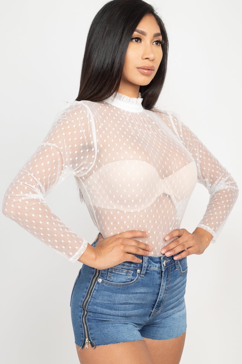 Playful polka dots meet modern mesh in this flirty mock neck top that's ready to turn heads. Long sleeves keep things chic while the back keyhole adds just the right touch of intrigue. Whether you're dressing up for a night out or keeping it casual, this woven wonder brings fun and sophistication to every outfit.