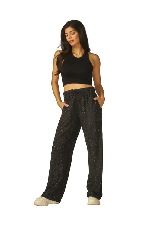 Made from a lightweight, super comfy loungewear pants with a adjustable drawstring waist. Has all over rhinestones, two side pockets and straight legs pants silhouette. In vintage destroyed condition.
