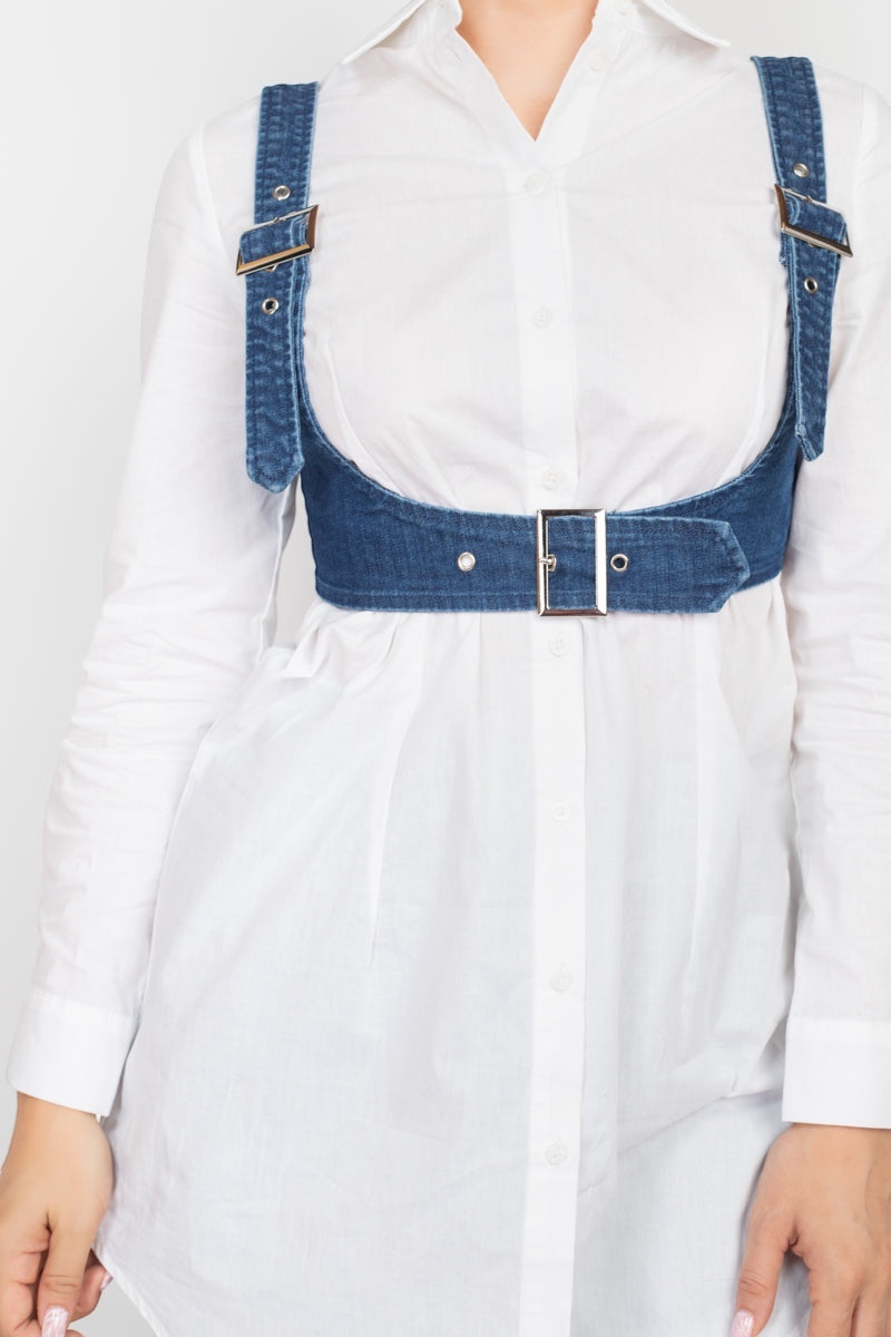 Luxe Life Styled blue denim vest with adjustable buckle straps and belted trim hem, worn over a white button-up shirt.